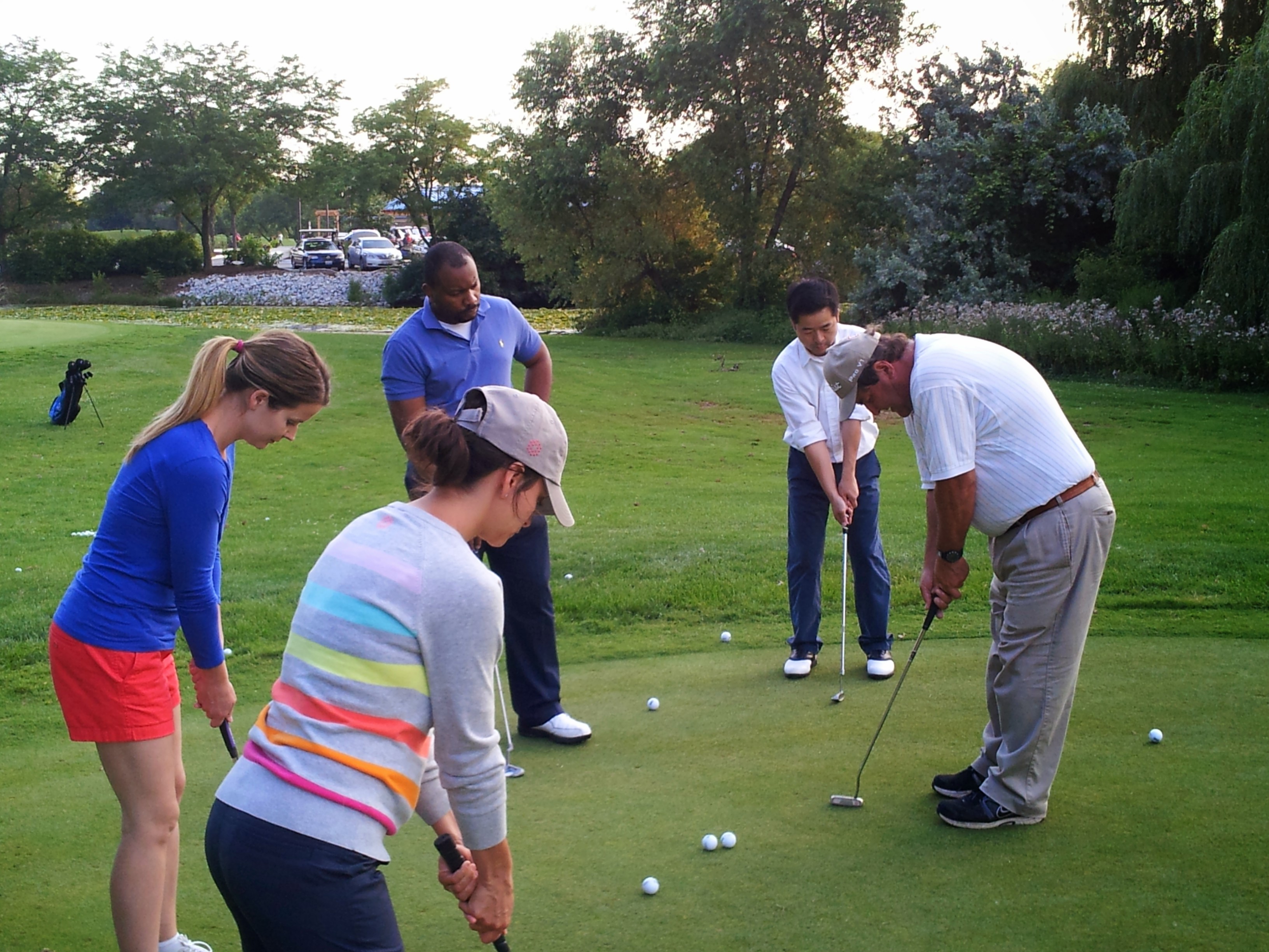Group learning to play golf